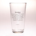 A clear glass pint glass with black printed Gemini zodiac text on the front, photographed against a clean white background.