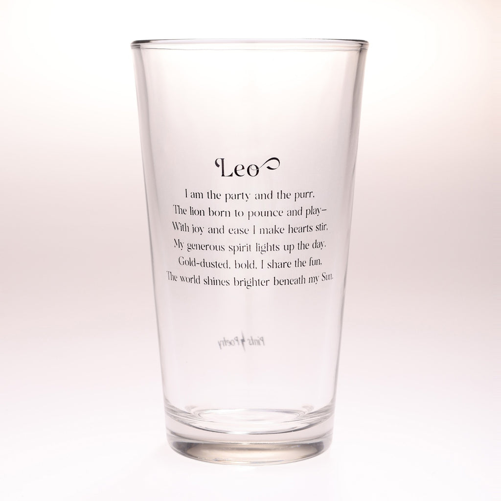 A clear glass drinking tumbler with black printed text reading 'Leo' and a playful astrological quote below, shown on a clean white background.