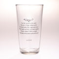 A clear glass drinking tumbler with black printed text featuring the Virgo zodiac sign and a poem, shown on a clean white background.